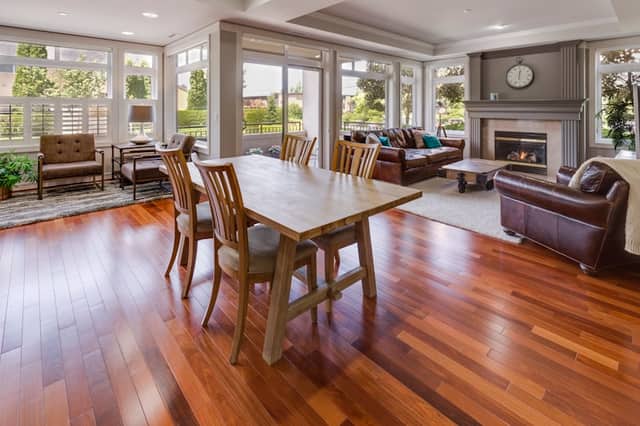 Finished hardwood floor in a dining room with table and chairs